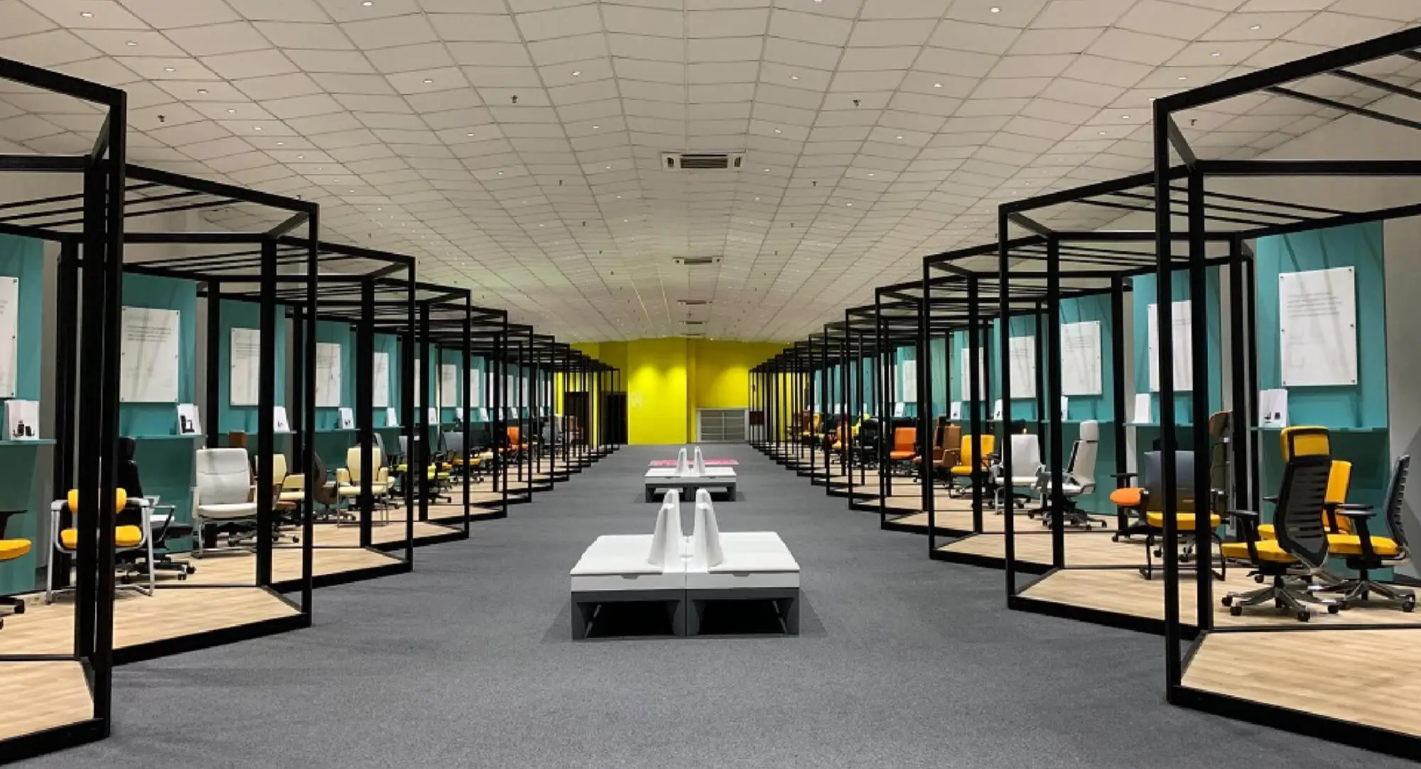 Merryfair's Klang showroom: two long rows of open display bays, each holding a different office chair