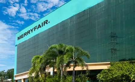 Merryfair's Malaysian headquarters, a tall green-clad building with the Merryfair sign