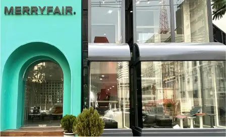 Merryfair's Thailand showroom, a teal arched entrance beside a glass frontage